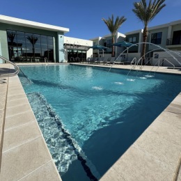 pool with modern stonework and reclining seats