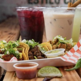 taco stand with colorful drinks